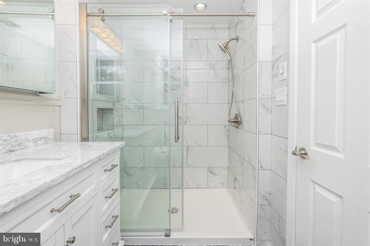 902 Croton Road Wayne, PA 19087 - Photo 33 of 37 a bathroom with a shower and a sink