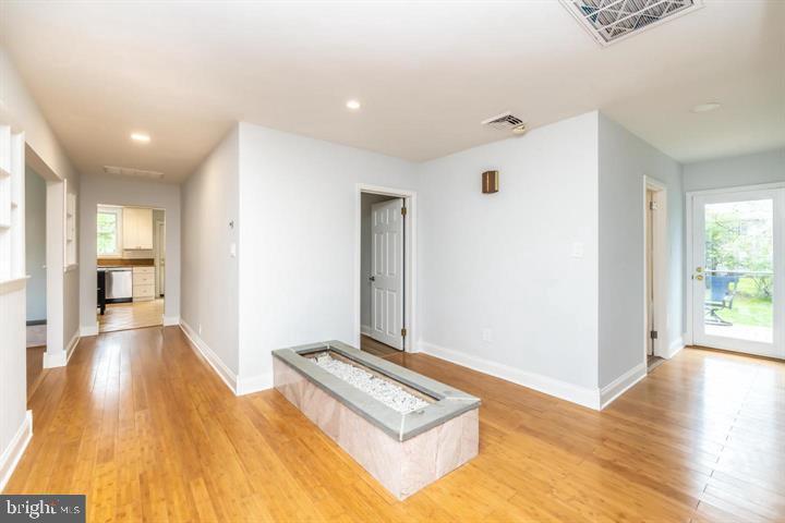 902 Croton Road Wayne, PA 19087 - Photo 5 of 37 a view of a hallway with wooden floor and windows