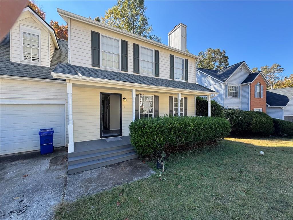 2441 Northmill Lane Decatur, GA 30035 - Photo 1 of 22 a front view of a house with garden