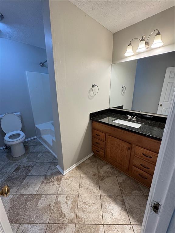 2441 Northmill Lane Decatur, GA 30035 - Photo 19 of 22 a kitchen with a sink a toilet and cabinets