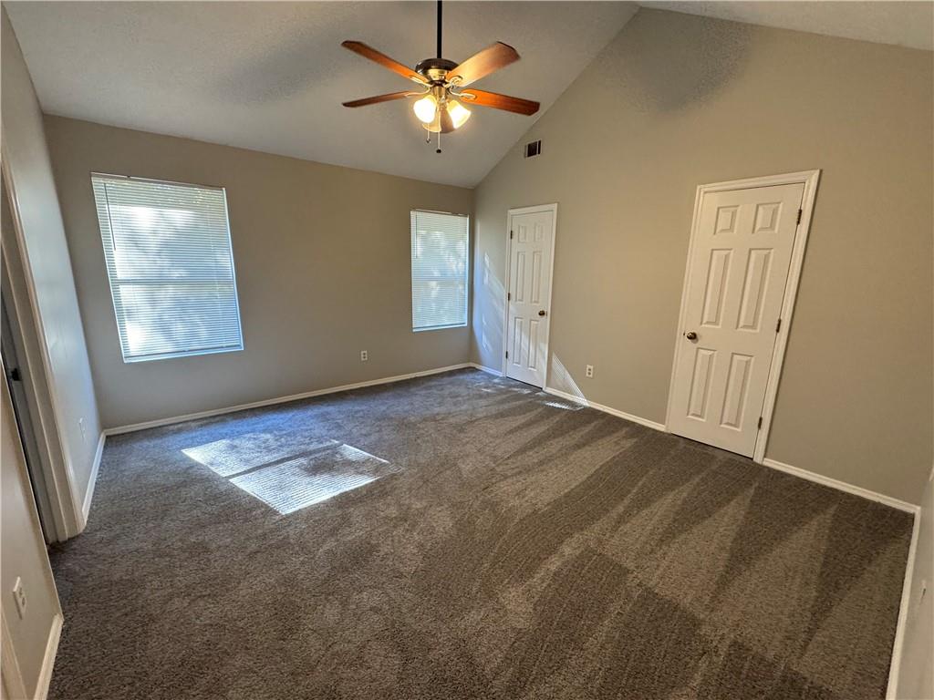 2441 Northmill Lane Decatur, GA 30035 - Photo 21 of 22 a view of an empty room with window and chandelier fan