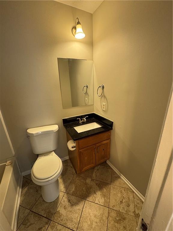2441 Northmill Lane Decatur, GA 30035 - Photo 22 of 22 a bathroom with a toilet and a mirror