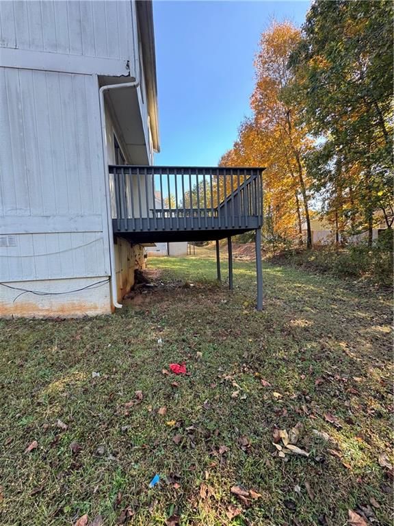2441 Northmill Lane Decatur, GA 30035 - Photo 5 of 22 a view of a yard with a bench and wooden fence