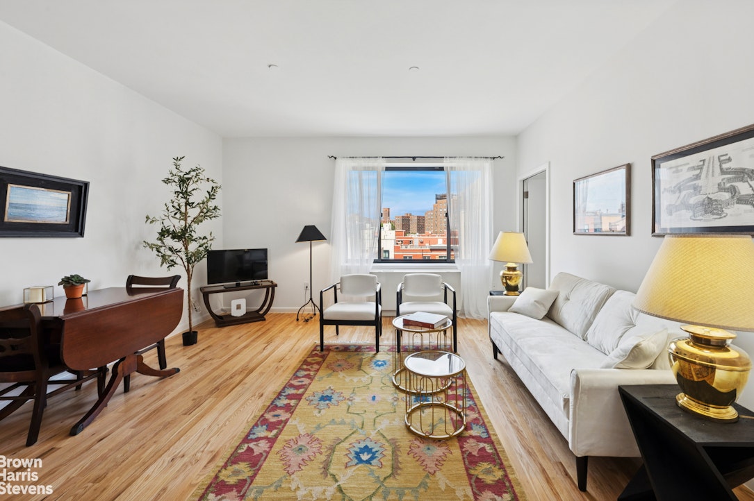 69 East 130th Street, Unit PHB Manhattan, NY 10037 - Photo 1 of 26 a living room with furniture and a wooden floor