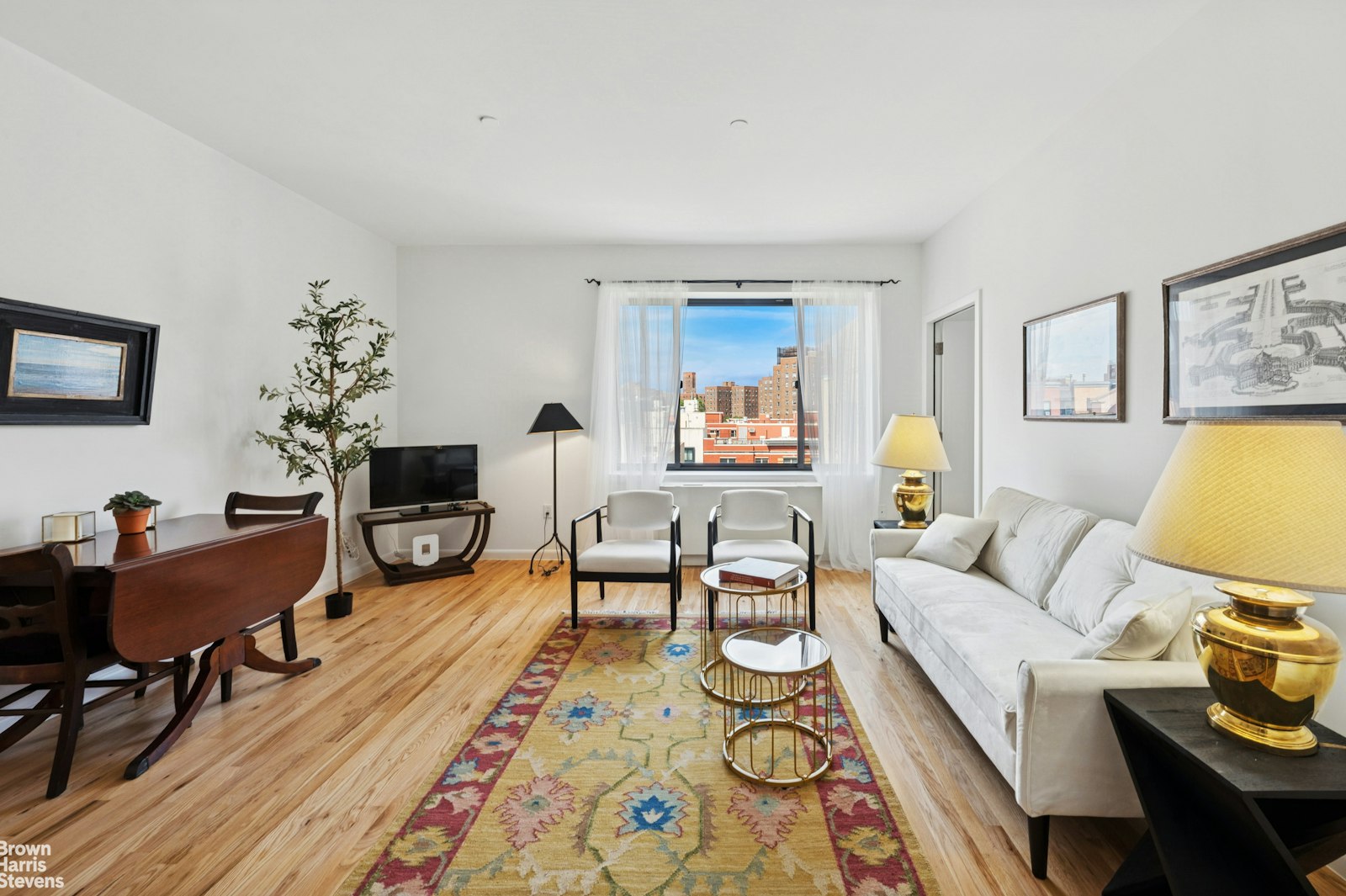 69 East 130th Street, Unit PHB Manhattan, NY 10037 - Photo 11 of 26 a living room with furniture and a wooden floor