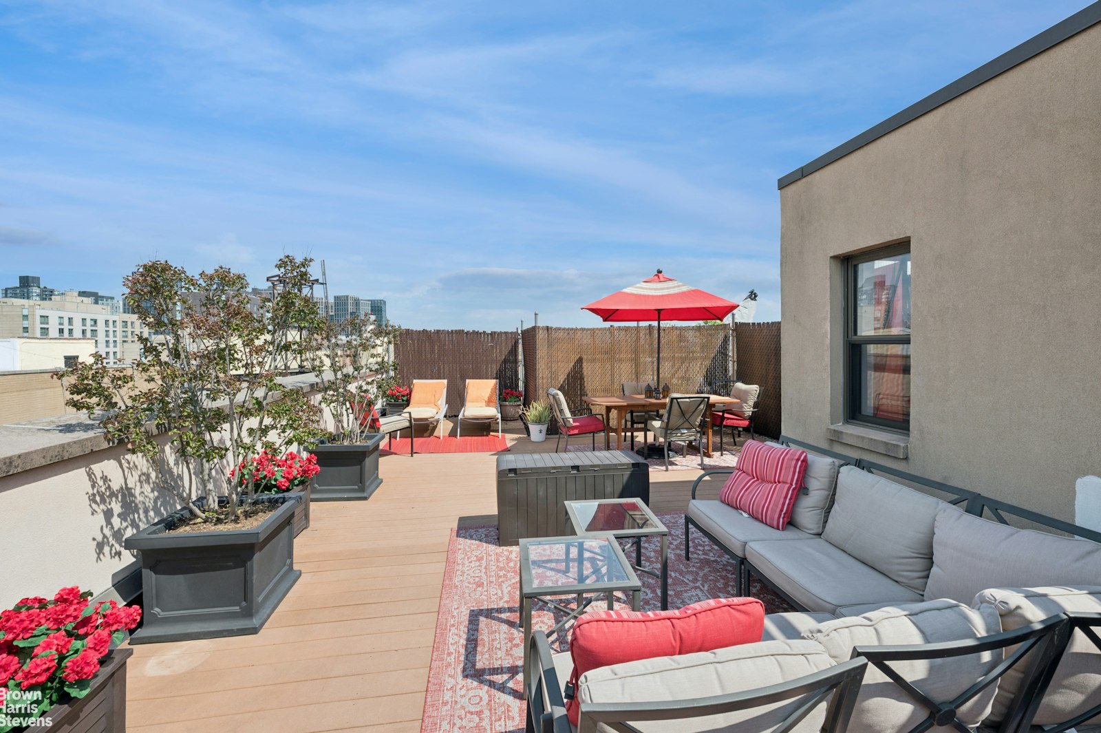 69 East 130th Street, Unit PHB Manhattan, NY 10037 - Photo 14 of 26 a dining room filled with lots of furniture and a potted plants