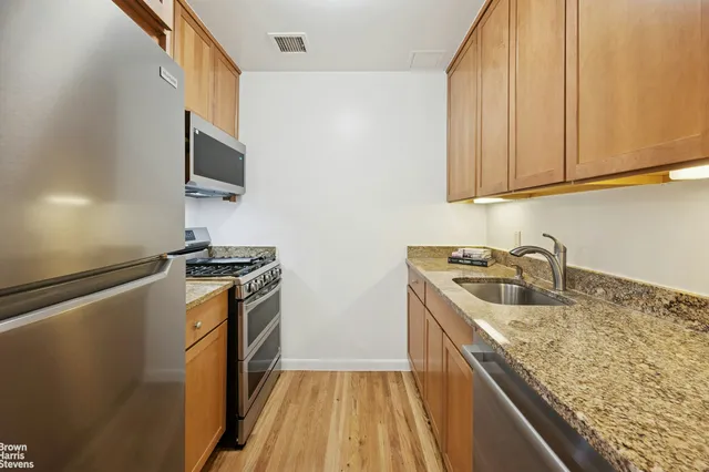 a living room with furniture and flowers
