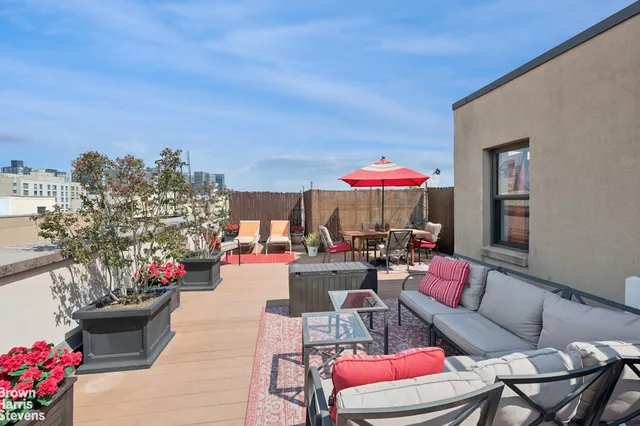 a outdoor space with patio the couches and a potted plant on the road