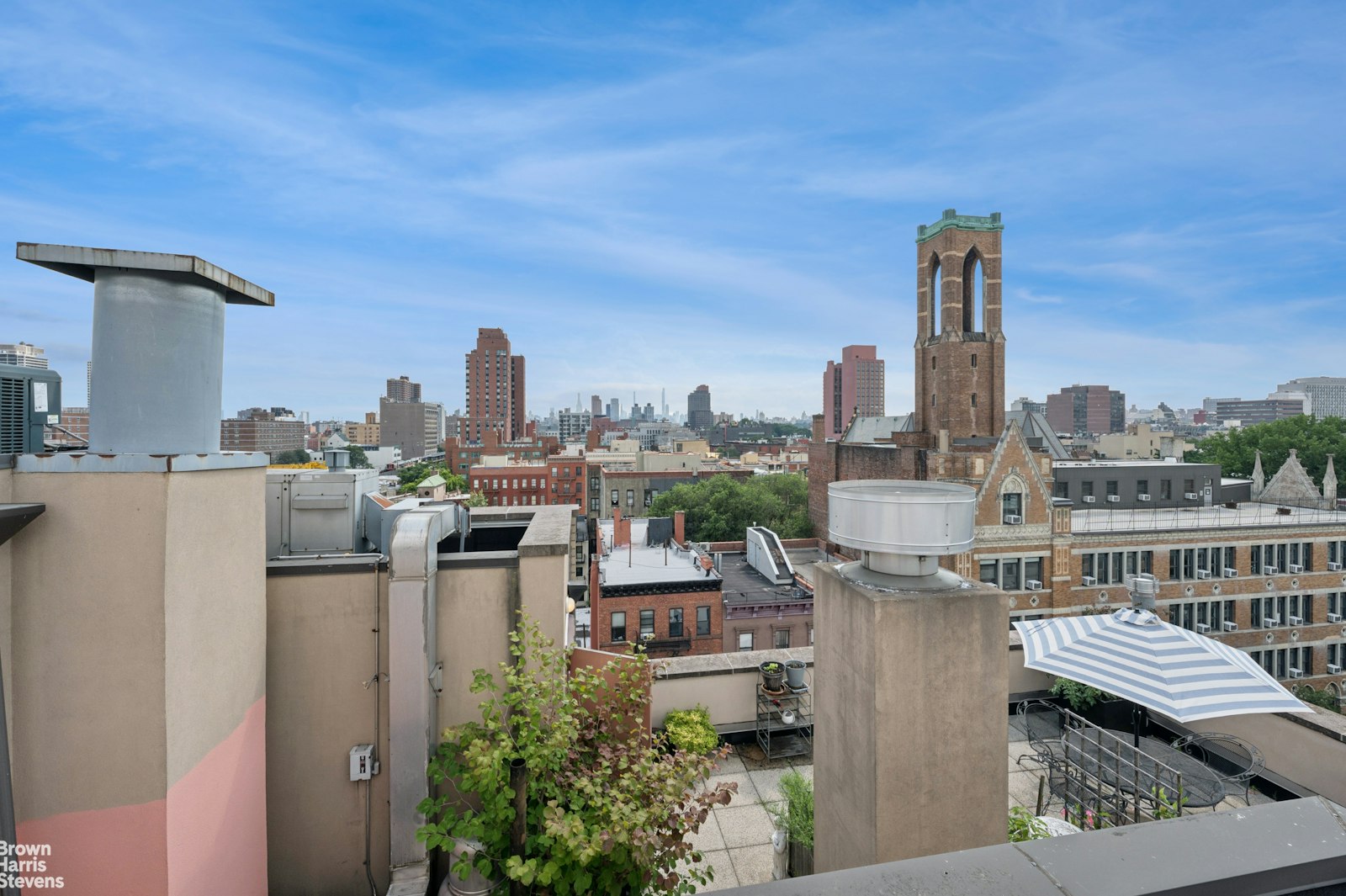 69 East 130th Street, Unit PHB Manhattan, NY 10037 - Photo 23 of 26 a view of a city from a terrace