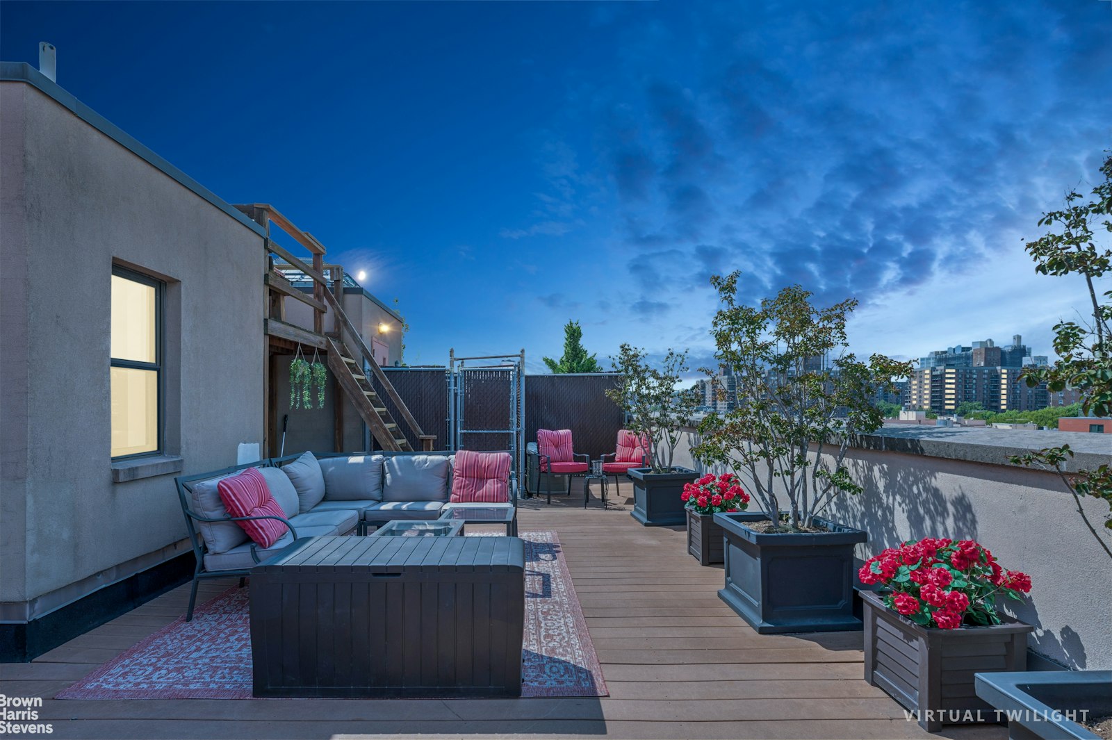 69 East 130th Street, Unit PHB Manhattan, NY 10037 - Photo 24 of 26 a living room with patio furniture and a potted plant