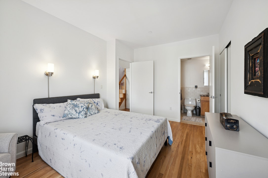 69 East 130th Street, Unit PHB Manhattan, NY 10037 - Photo 4 of 26 a bed room with a bed and a television