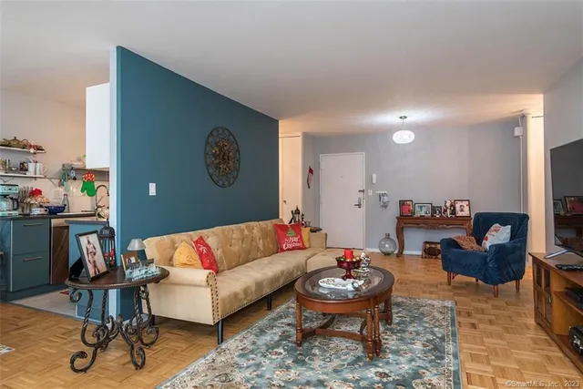 a living room with furniture and a rug