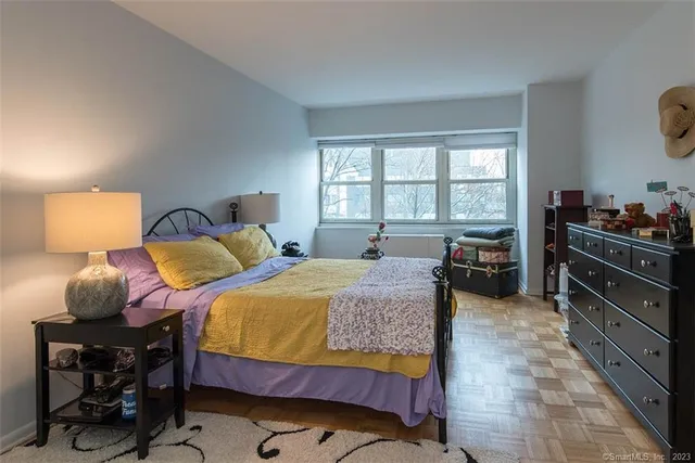 a bed room with a bed and a television