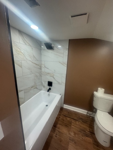608 Front Street Aurora, IL 60505 - Photo 2 of 10 a bathroom with a bathtub and toilet
