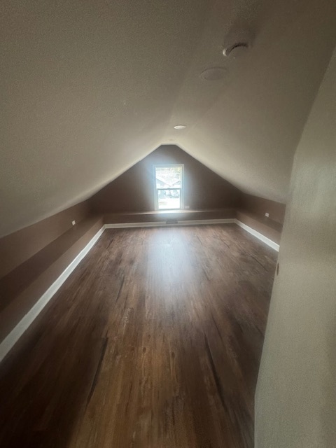 608 Front Street Aurora, IL 60505 - Photo 7 of 10 an empty room with wooden floor and windows
