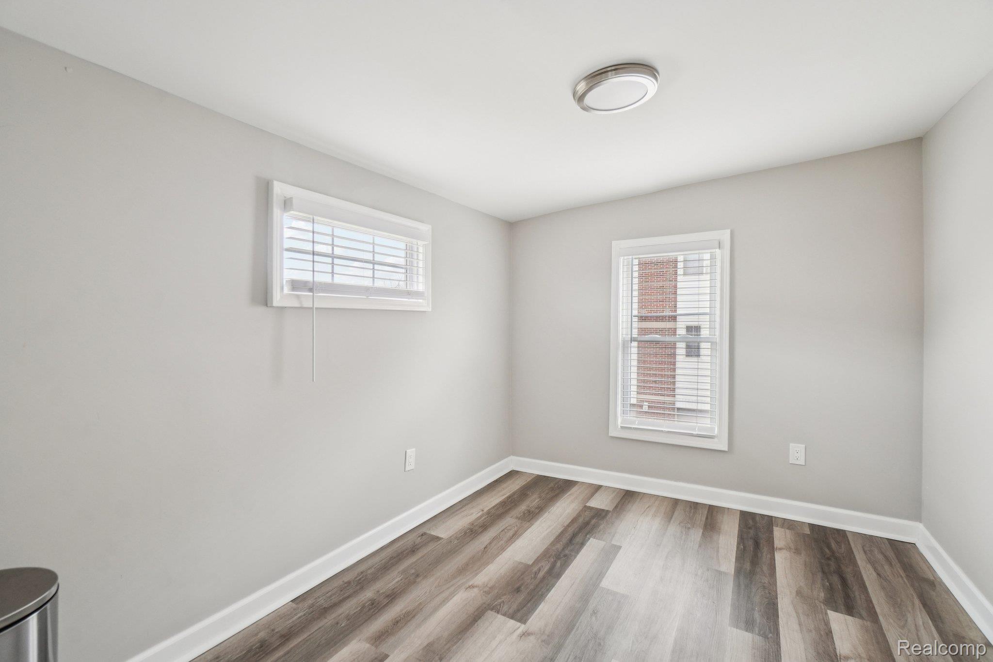 3822 Wabash Street Detroit, MI 48208 - Photo 7 of 17 Unfurnished room with light wood finished floors and baseboards