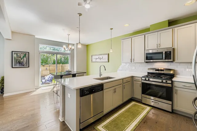 a kitchen with a stove and a sink