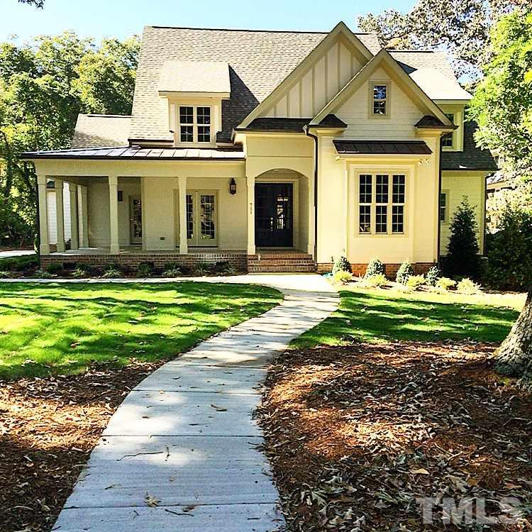 711 Brooks Avenue Raleigh, NC 27607 - Photo 1 of 1 a front view of a house with a yard