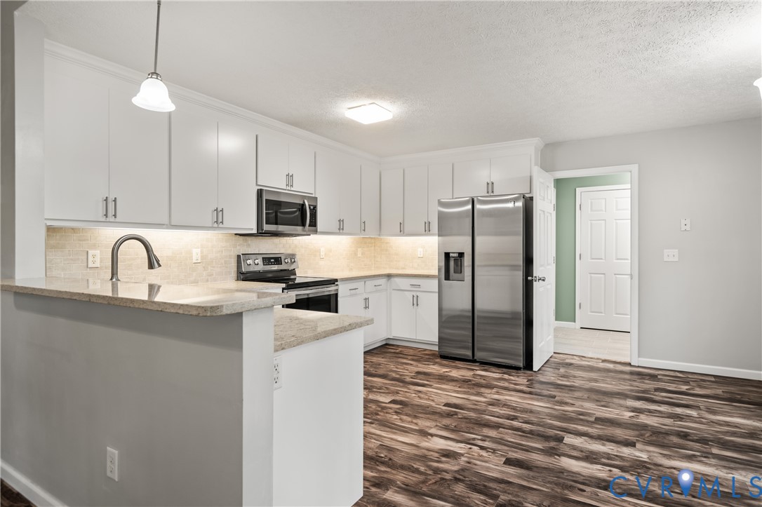 2099 Yacht Club Road Hayes, VA 23072 - Photo 14 of 42 a kitchen with a refrigerator sink and microwave