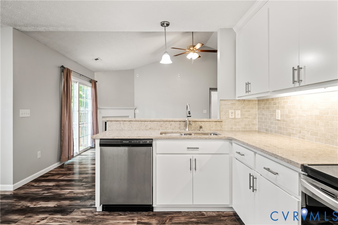 2099 Yacht Club Road Hayes, VA 23072 - Photo 17 of 42 a kitchen with a sink window and cabinets