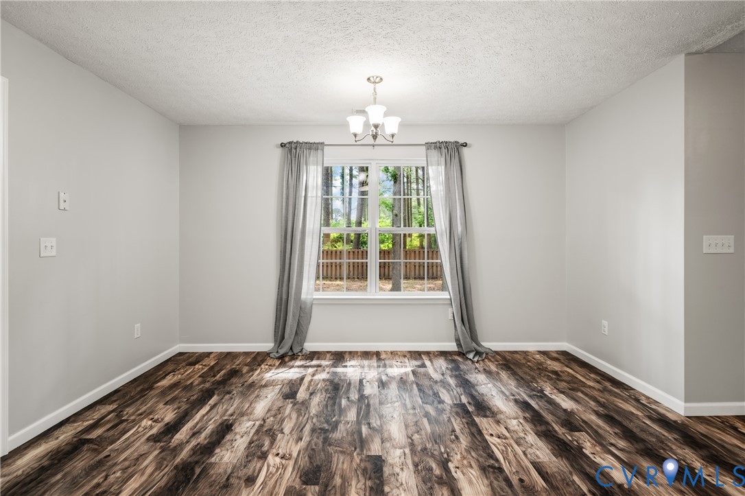 2099 Yacht Club Road Hayes, VA 23072 - Photo 20 of 42 a view of empty room with wooden floor and fan