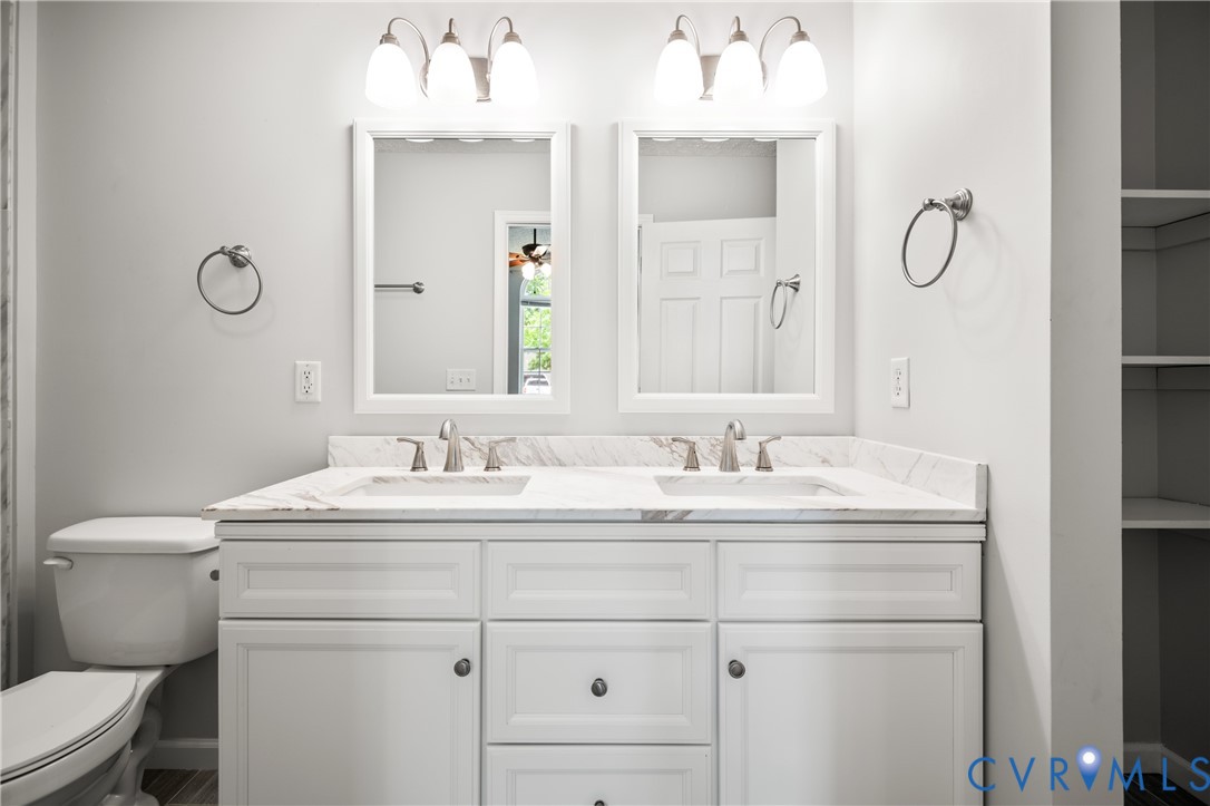 2099 Yacht Club Road Hayes, VA 23072 - Photo 26 of 42 a bathroom with a sink vanity and a toilet