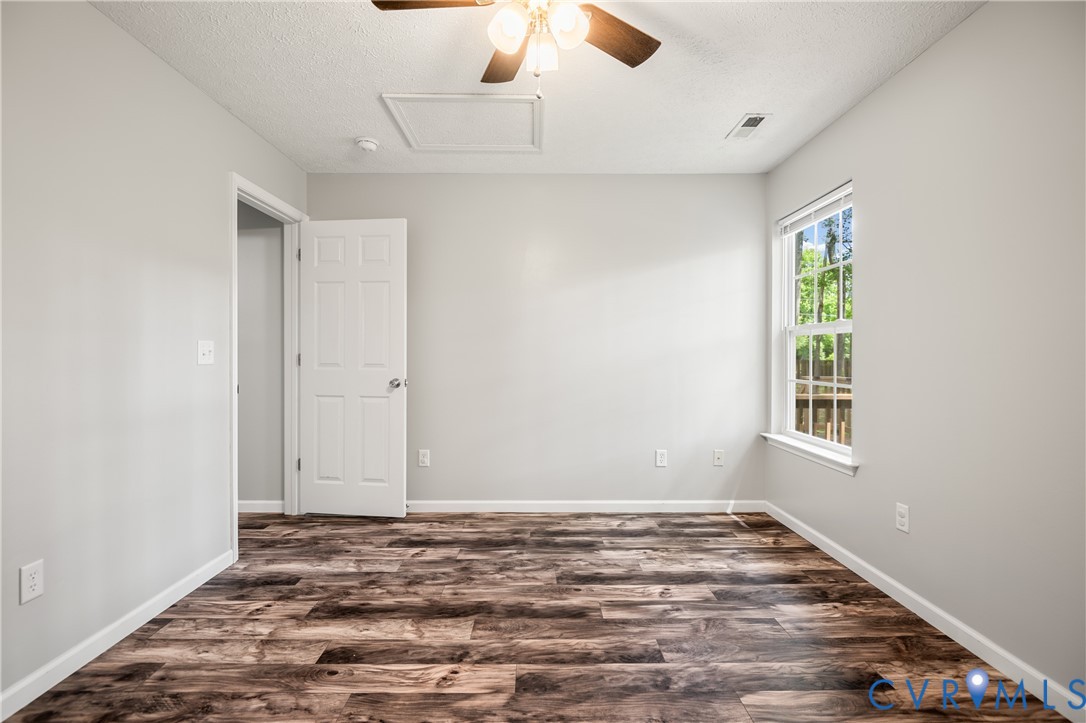 2099 Yacht Club Road Hayes, VA 23072 - Photo 33 of 42 wooden floor in an empty room with a window