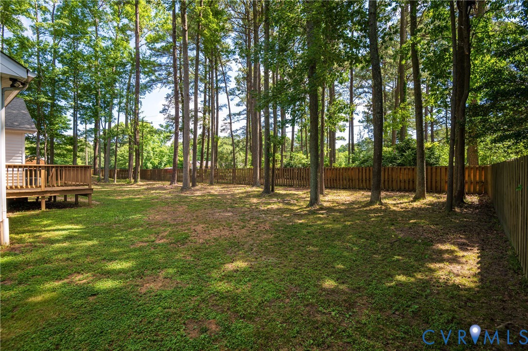 2099 Yacht Club Road Hayes, VA 23072 - Photo 39 of 42 a view of outdoor space with deck and trees