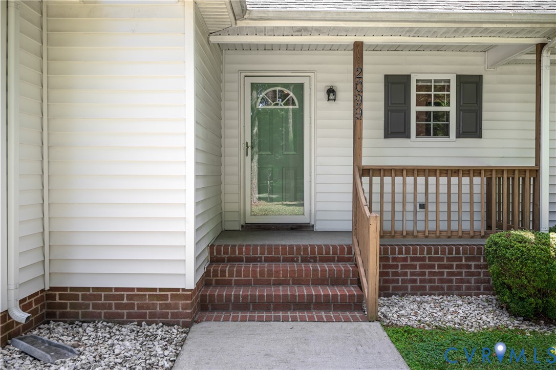 2099 Yacht Club Road Hayes, VA 23072 - Photo 5 of 42 a front view of a house with a door