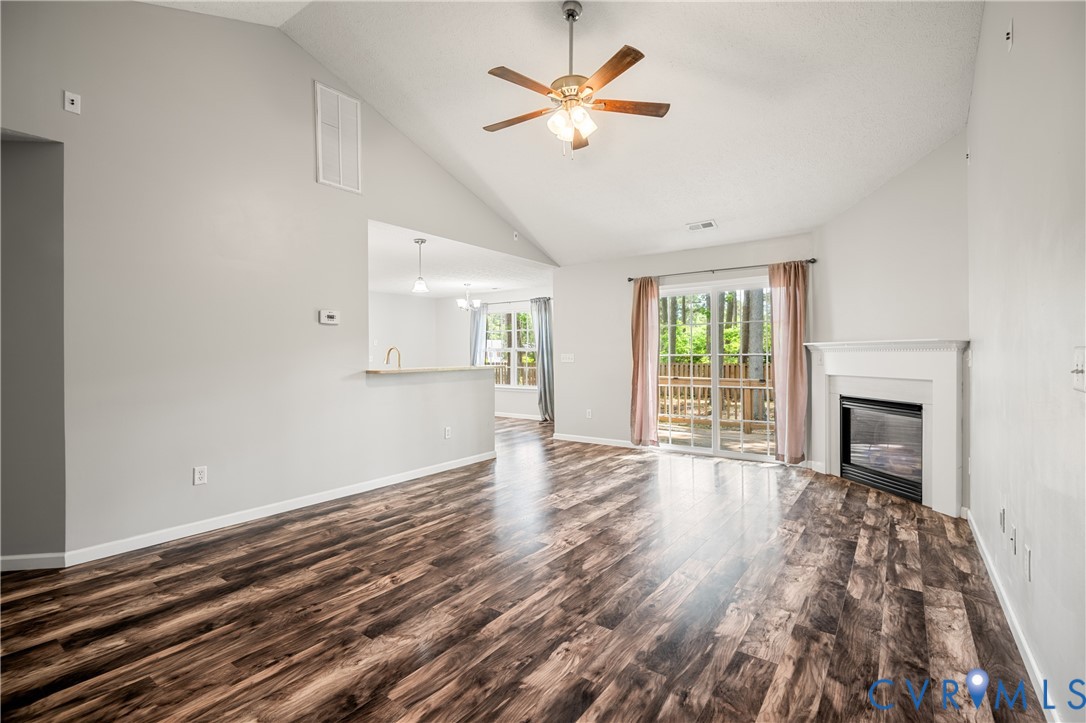 2099 Yacht Club Road Hayes, VA 23072 - Photo 10 of 42 a view of an empty room with a fireplace and a window