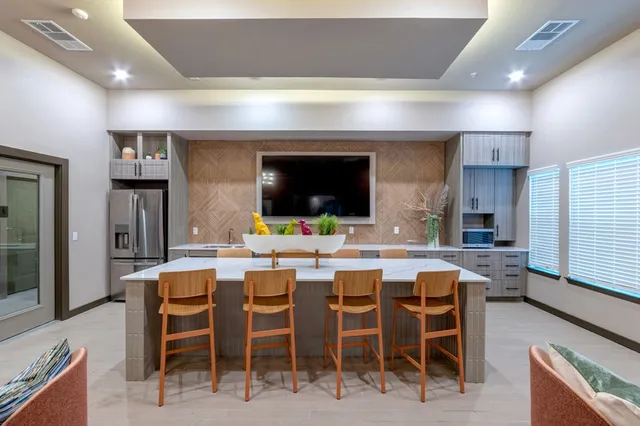 a kitchen with a table and chairs