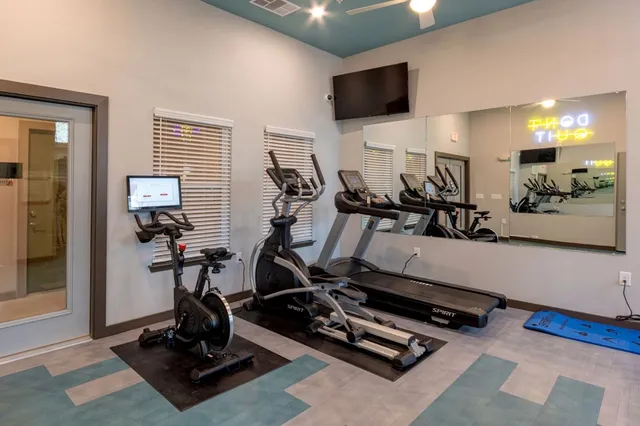 a view of a room with gym equipment