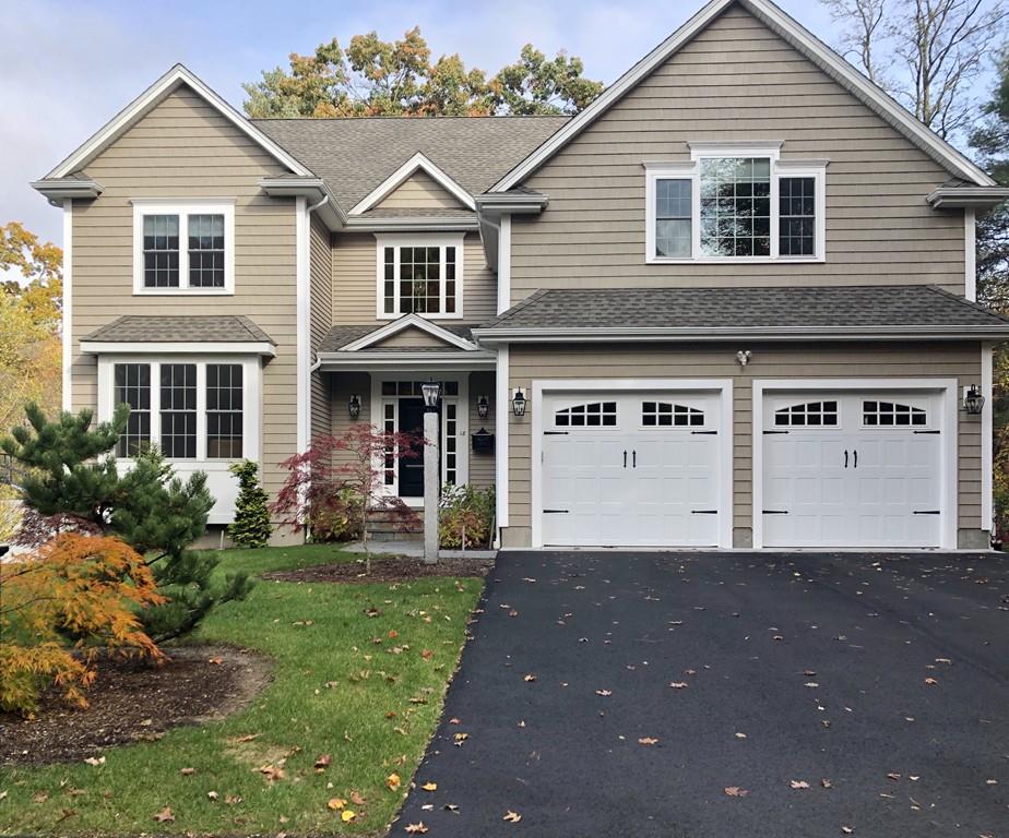 18 Webb Avenue Wellesley, MA 02481 - Photo 1 of 19 a front view of a house with a yard and garage