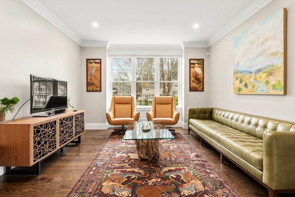 18 Webb Avenue Wellesley, MA 02481 - Photo 3 of 19 a living room with furniture and a flat screen tv
