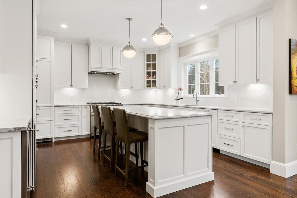 18 Webb Avenue Wellesley, MA 02481 - Photo 5 of 19 a kitchen with stainless steel appliances granite countertop a sink a stove and a refrigerator