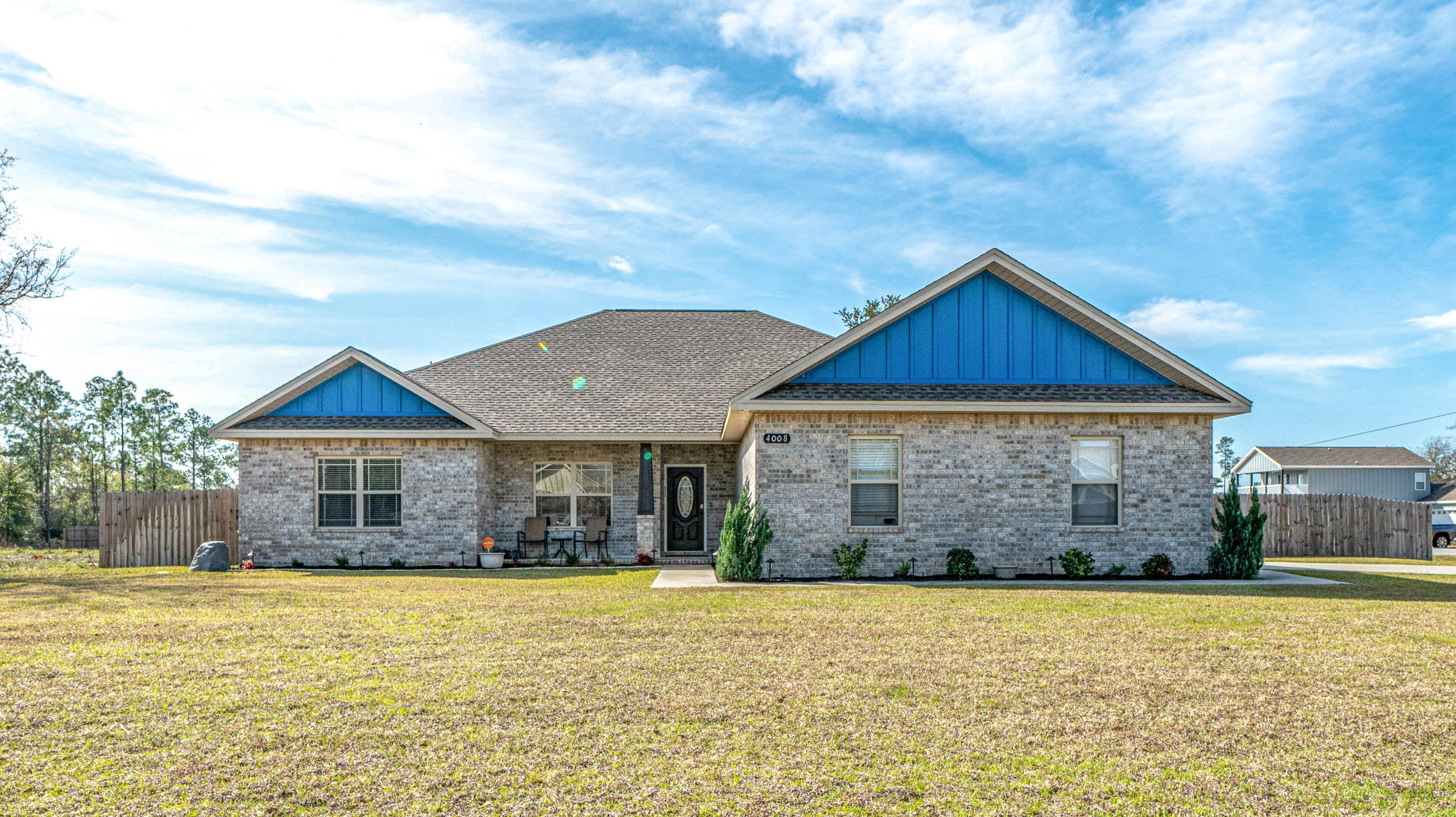 4008 Happy Trails Road Crestview, FL 32539 - Photo 1 of 32 a front view of a house with a yard