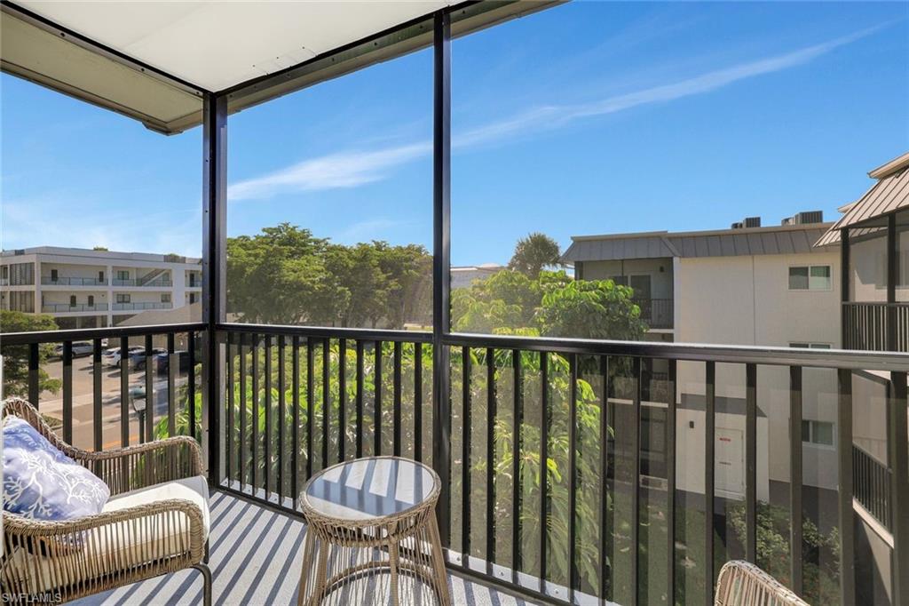 766 Central Avenue, Unit 304 Naples, FL 34102 - Photo 22 of 29 a view of a balcony with chair