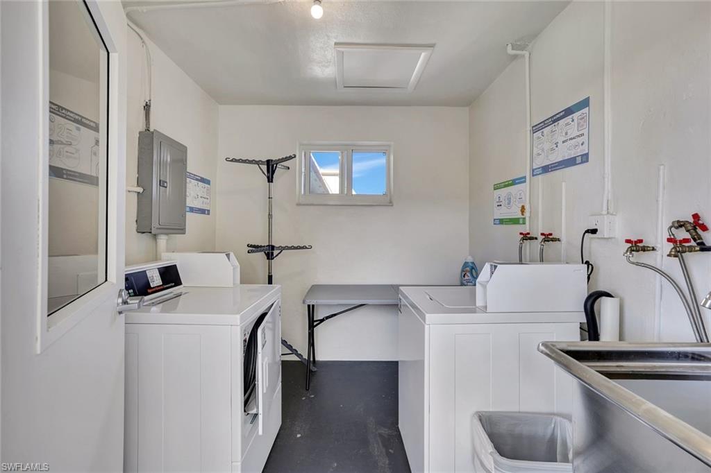 766 Central Avenue, Unit 304 Naples, FL 34102 - Photo 24 of 29 a bathroom with a sink and a mirror