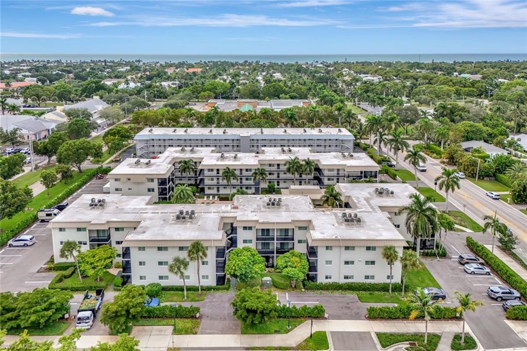 766 Central Avenue, Unit 304 Naples, FL 34102 - Photo 4 of 29 an aerial view of residential building with outdoor space