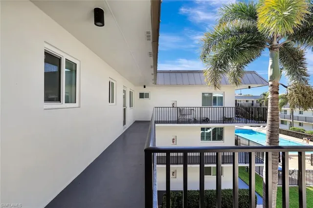 a kitchen view with a counter space a sink and cabinets