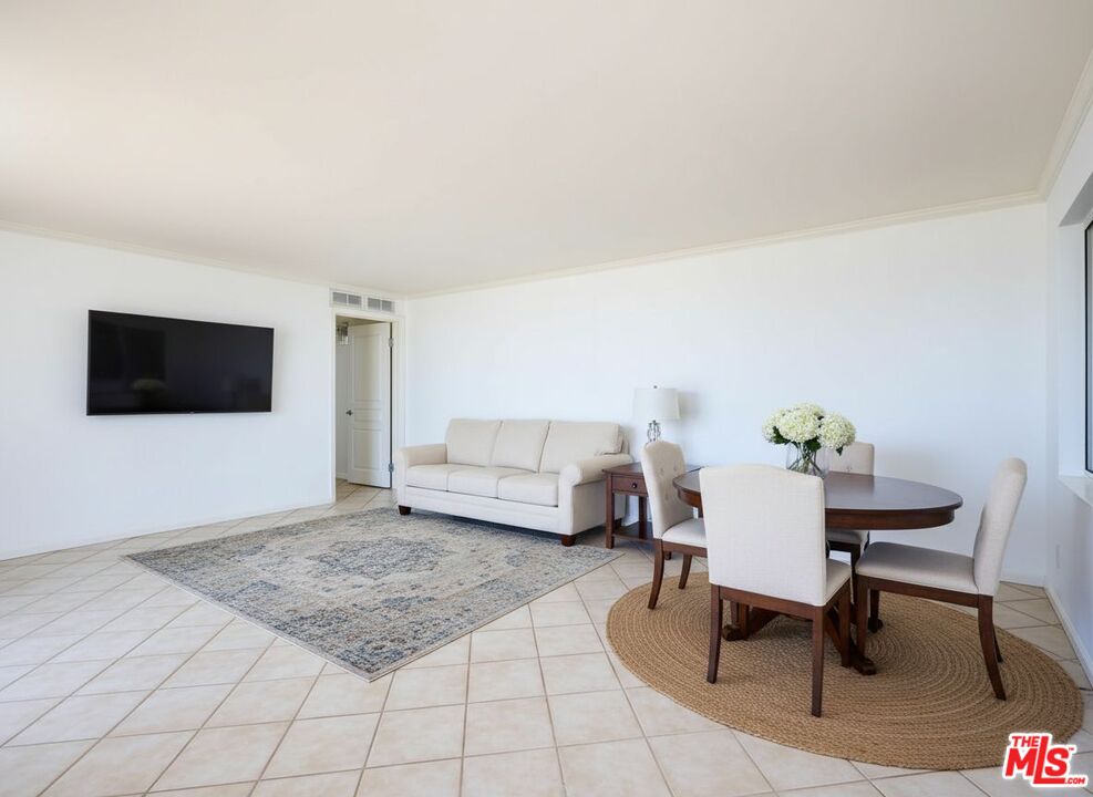 7320 Hawthorn Avenue, Unit 222 Los Angeles, CA 90046 - Photo 14 of 33 a living room with furniture and a flat screen tv