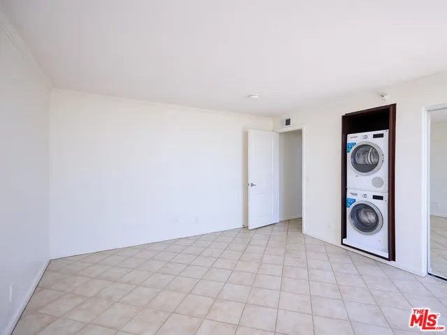 a view of a storage & utility room with a washer and dryer