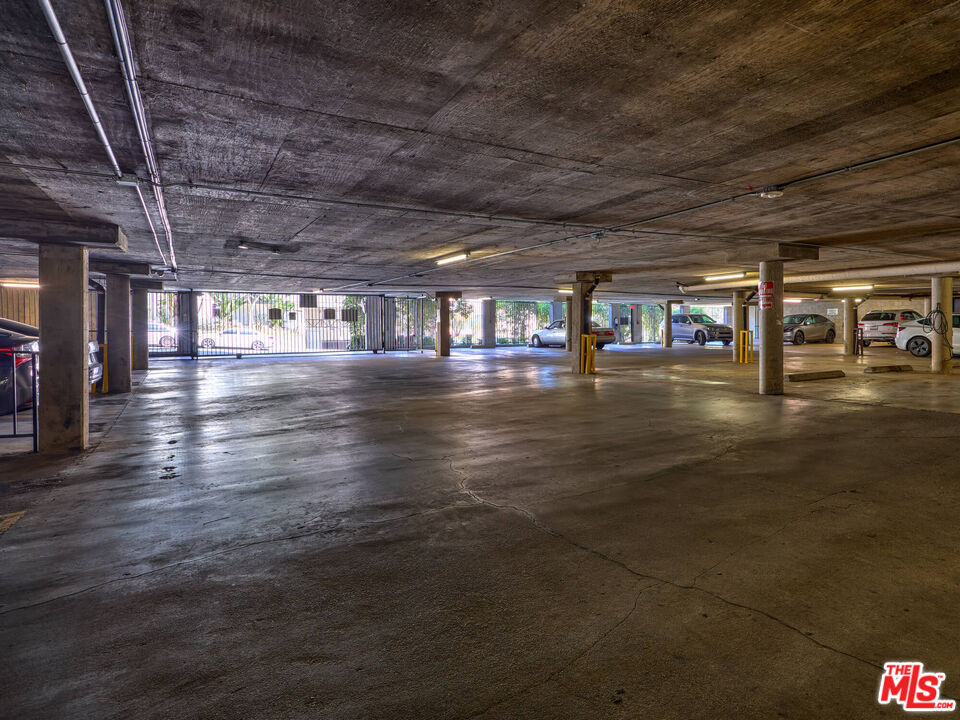 7320 Hawthorn Avenue, Unit 222 Los Angeles, CA 90046 - Photo 32 of 33 a view of an empty room with wooden floor