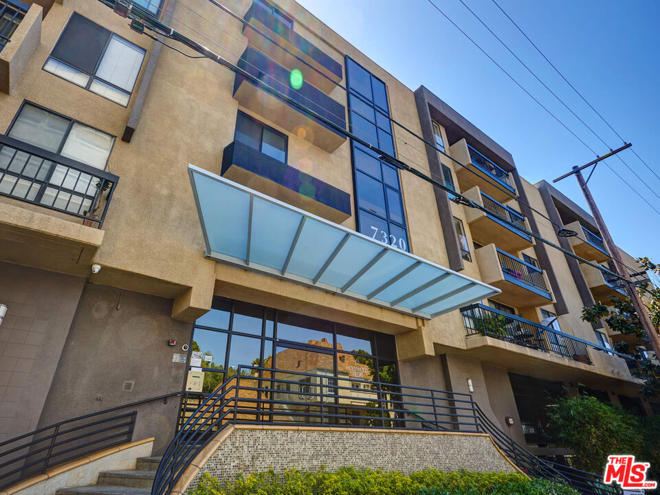 7320 Hawthorn Avenue, Unit 222 Los Angeles, CA 90046 - Photo 4 of 33 a view of building with a yard