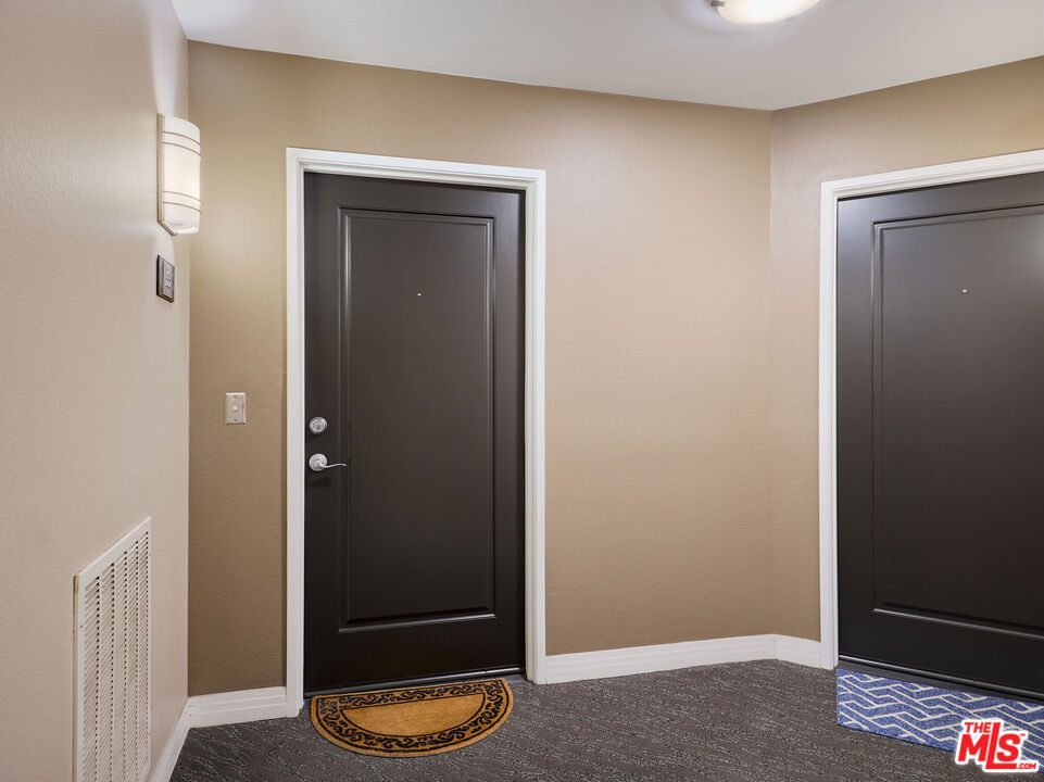 7320 Hawthorn Avenue, Unit 222 Los Angeles, CA 90046 - Photo 8 of 33 a view of an entryway door