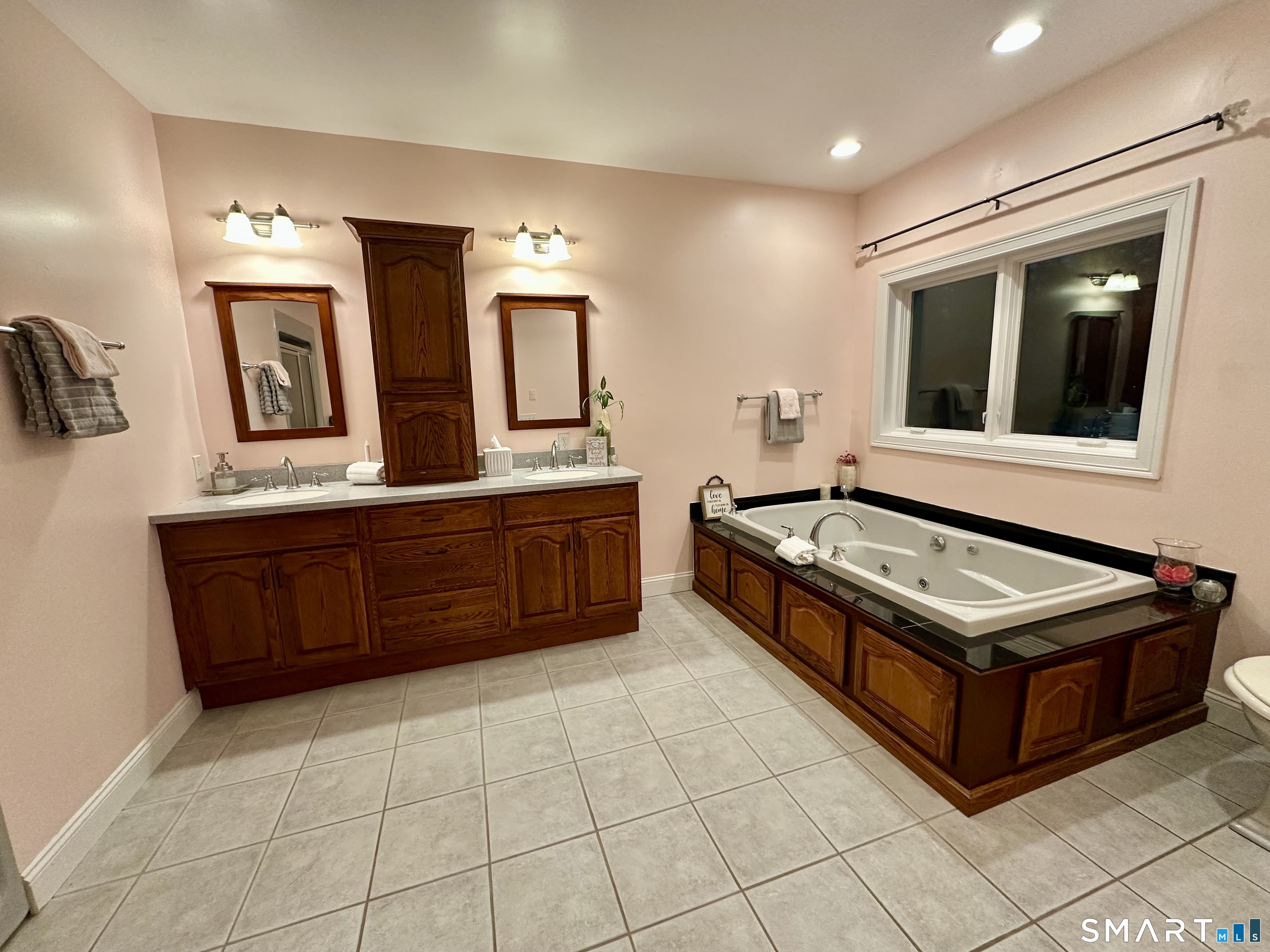 455 Chesterfield Road Montville, CT 06370 - Photo 13 of 40 a spacious bathroom with a double vanity sink and a mirror