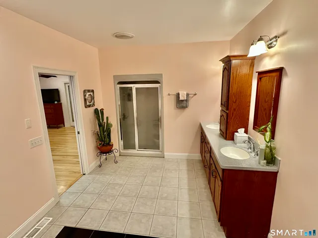 a bathroom with a sink and mirror