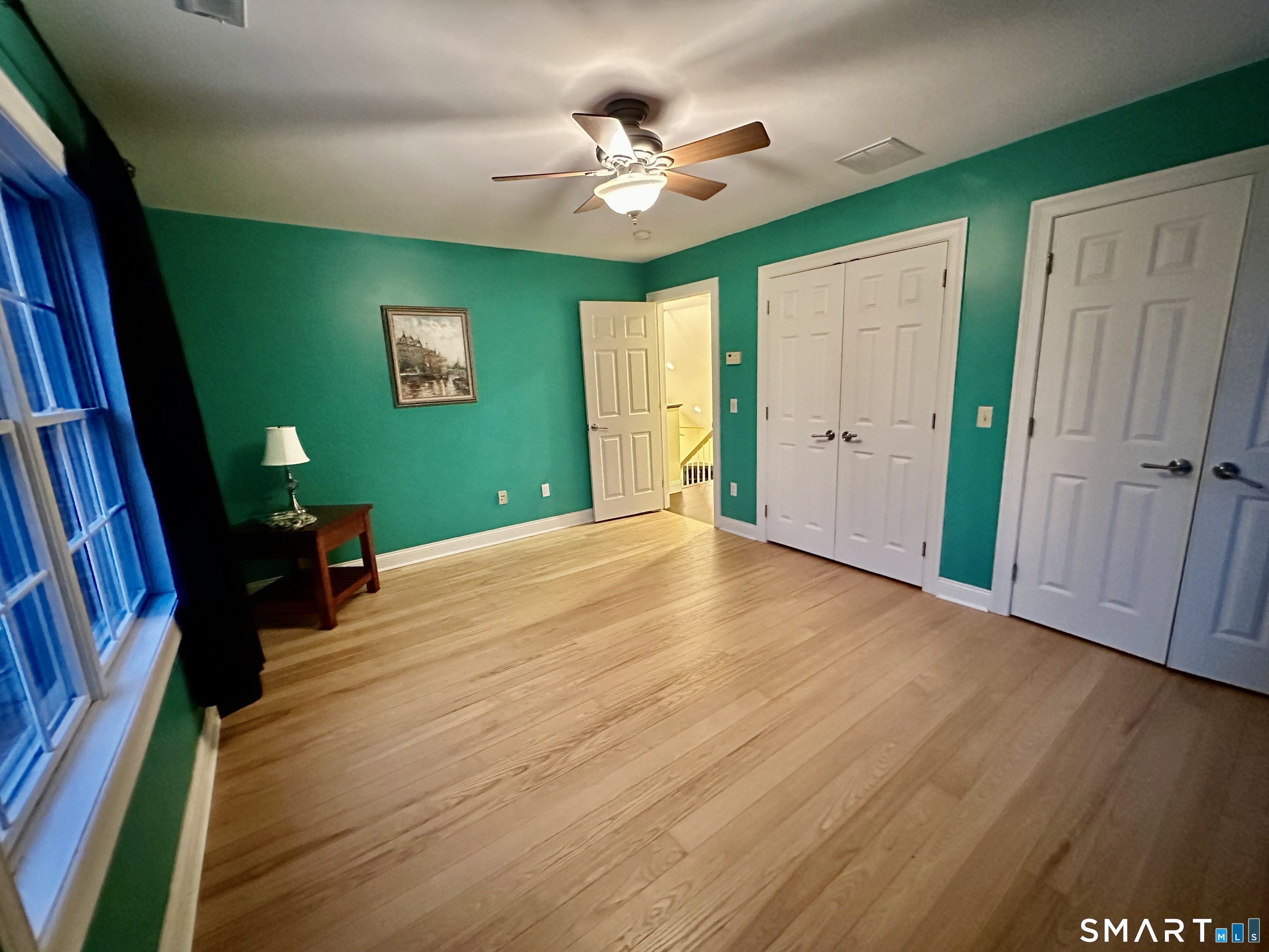 455 Chesterfield Road Montville, CT 06370 - Photo 21 of 40 a view of an empty room with a window and wooden floor