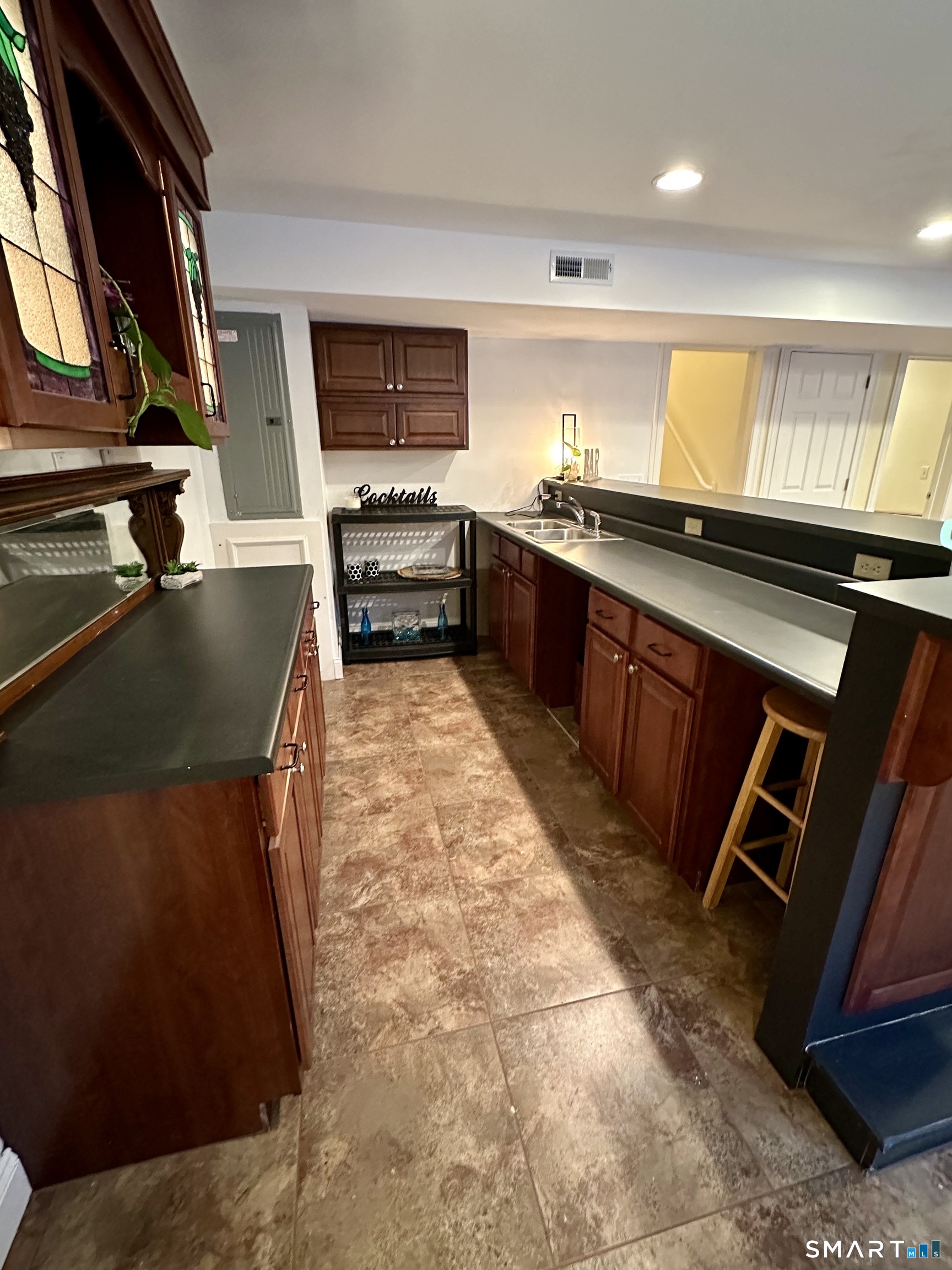455 Chesterfield Road Montville, CT 06370 - Photo 27 of 40 a kitchen with stainless steel appliances granite countertop a sink stove and cabinets