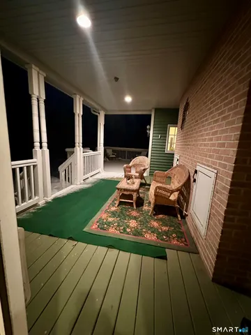 a living room with furniture hard wood floor and furniture